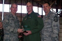 SEYMOUR JOHNSON AIR FORCE BASE, N.C. --Staff Sgt. Steve Stanton  (middle) earns the Noncommissioned Officer of the Year Award for 2007 for the 916th Air Refueling Wing. Col. Fritz Linsenmeyer (left), wing commander and Command Chief Master Sgt. Lester Boltinhouse present the award to the boom operator during the February unit training assembly. U.S. Air Force photo/Tech. Sgt. Ian Gardner