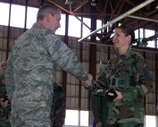 SEYMOUR JOHNSON AIR FORCE BASE, N.C. -- Master Sgt. Jennifer Ward (right) shakes hands with Col. Fritz Linsenmeyer, wing commander of the 916th Air Refueling Wing, after receiving her award for Senior Noncommissioned Officer of the Year for 2007. Sgt. Ward is a reservist with the 916th Aircraft Maintenance Squadron. U.S. Air Force photo/Tech. Sgt. Ian Gardner