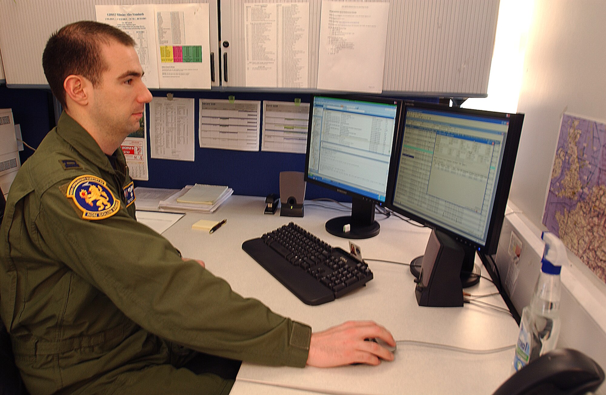Capt. Tim Feely, 100th Operations Support Squadron chief of wing scheduling, updates higher headquarters-tasked missions in the flying schedule. The 100th OSS's wing scheduling flight helps coordinate the 100th Air Refueling Wing’s fleet of KC-135s with corresponding missions. (U.S. Air Force by Senior Airman Clark Staehle)