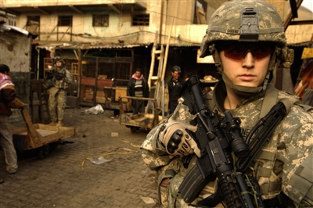 U.S. Army 1st Lt. Greene searches for improvised explosive device caches in Rusafa, Baghdad, Iraq, on Jan. 28, 2008.  Greene is assigned to 3rd Platoon, Charlie Company, 1st Battalion, 504th Parachute Infantry Regiment.  