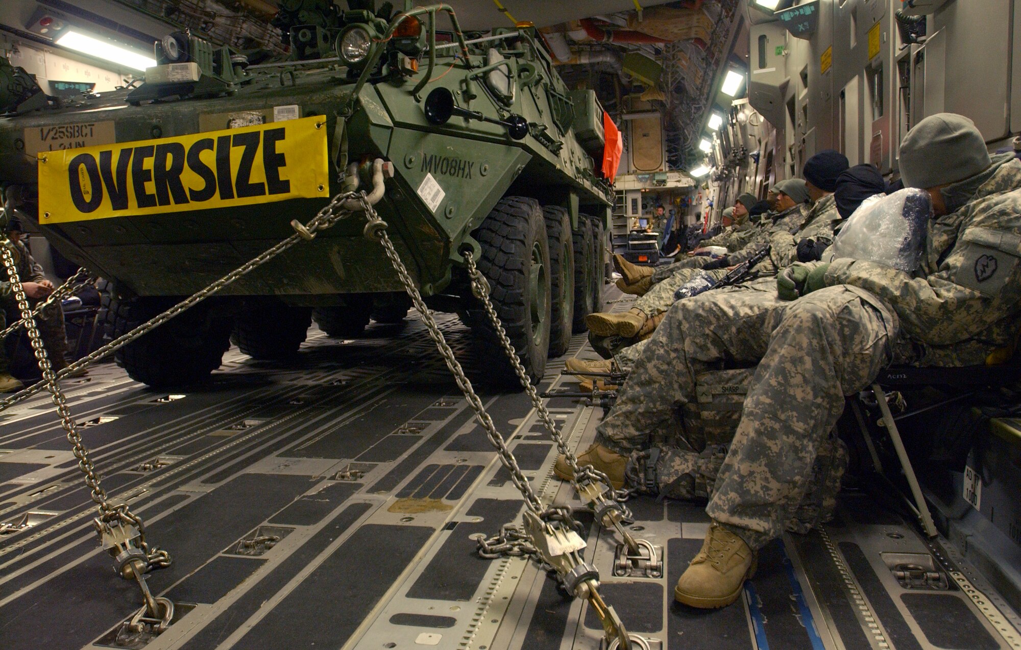 The flight from Eielson AFB, AK to the Republic of Korea is about 9 hours, so the members of the US Army's First Stryker Brigade Combat Team of the 25th Infantry Division, 1st Battalion 24th Infantry Regiment, Charlie Company from Fort Wainwright, Alaska rest along side their Stryker Vehicle prior to their journey aboard the C-17 Globemaster III that will transport them and their equipment to the Republic of Korea in support of the Foal Eagle exercise. It is the first time the USAF and US Army in Alaska has used joint assets to project combat power protection out of Alaska. The C-17 Globemaster III and its crew members are from the 517th Airlift Squadron, Elmendorf AFB, Alaska.

(U.S Air Force photo by: Staff Sgt Eric T. Sheler)
