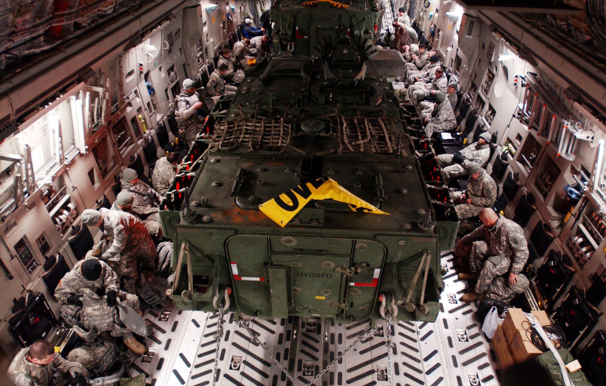 Members of the US Army's First Stryker Brigade Combat Team of the 25th Infantry Division, 1st Battalion 24th Infantry Regiment, Charlie Company from Fort Wainwright, Alaska prepare for departure aboard the C-17 Globemaster III that will transport them and their equipment including two Stryker vehicles for their departure for their deployment to the Republic of Korea in support of the Foal Eagle exercise.  It is the first time the USAF and US Army in Alaska has used joint assets to project combat power protection out of Alaska. The C-17 Globemaster III and its crew members are from the 517th Airlift Squadron, Elmendorf AFB, Alaska.

(U.S Air Force photo by: Staff Sgt Eric T. Sheler)

