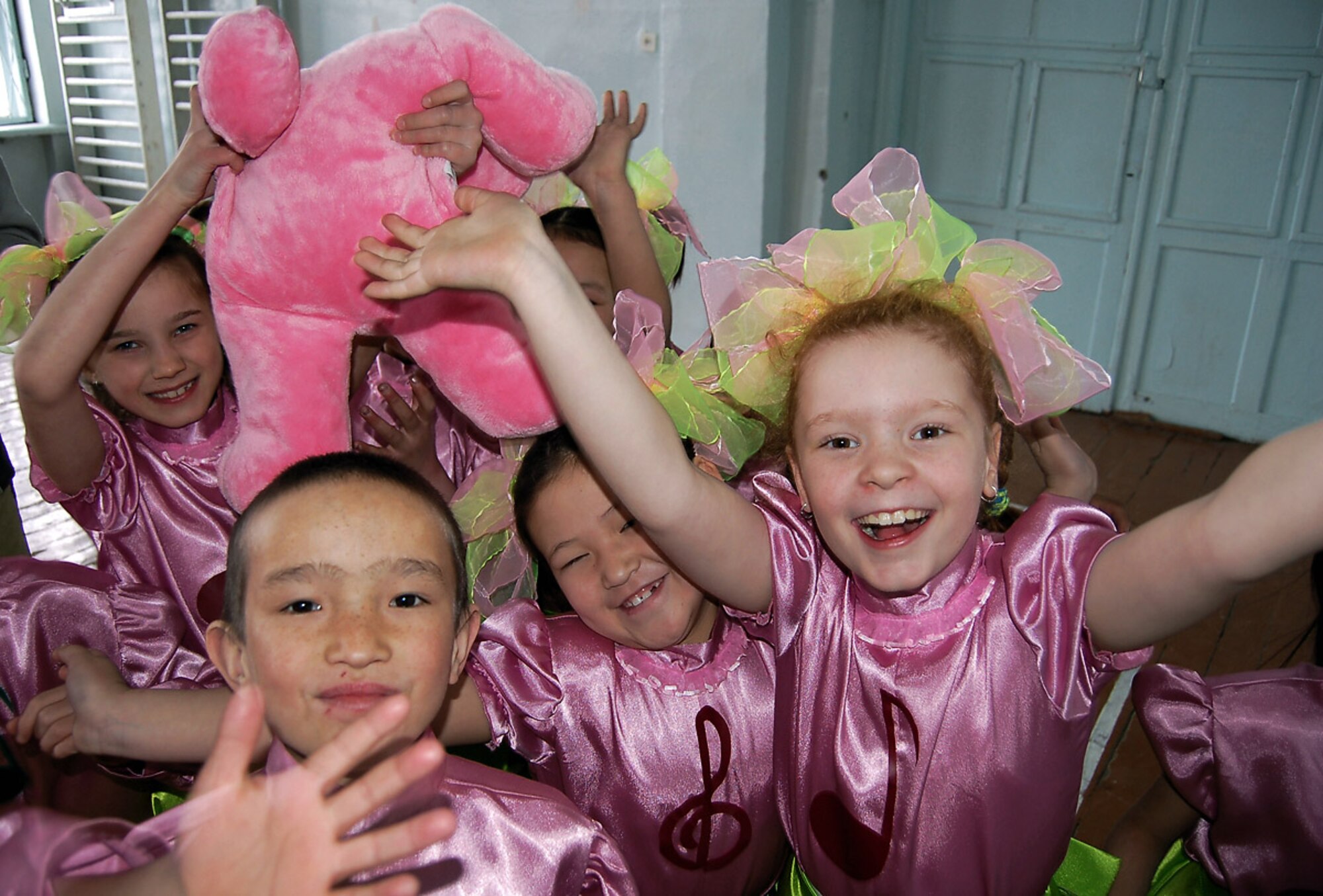 Bishkek Boarding School for the Deaf children show their appreciation for the toys and U.S. Central Command Air Forces Band Live Round?s musical performance. (U.S. Air Force photo/Senior Master Sgt. Greg Wade)