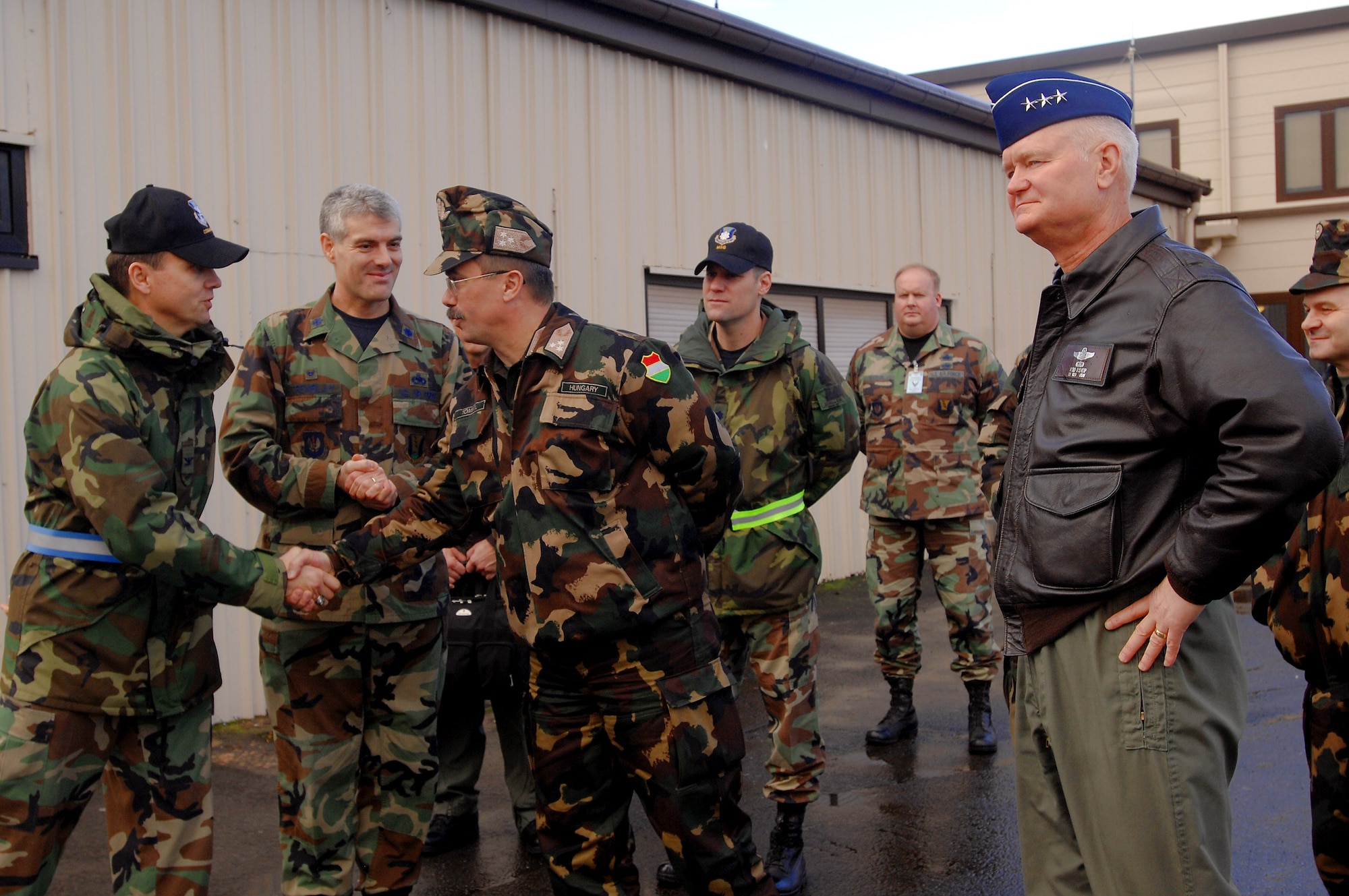 435th Air Base Wing Commander Col. Earl Mathews (left) thanks Lt. Gen. Laszlo Tombol, the Hungarian Joint Forces Command commander, for visiting, following a tour of the Joint Mobility Processing Center Feb. 6, on Ramstein Air Base, Germany. Lt. Gen. Robert D. "Rod" Bishop, the 3rd Air Force commander (far right) hosted the Hungarian general and discussed important topics helping both countries make head way on the war on terrorism. (U.S. Air Force photo/Airman 1st Class Kenny Holston) 