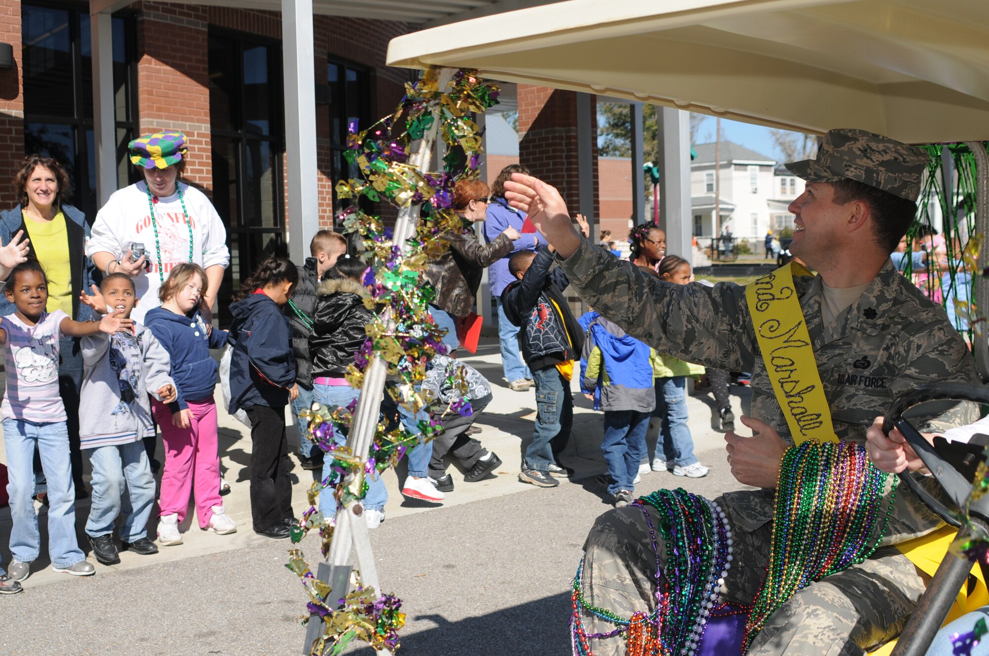 Lt. Col. Paul Valenzuela, 81 Mission Support Squadron commander, serves as grand marshal of the Gorenflo Elementary Mardi Gras parade in Biloxi Feb. 1.  (U.S. Air Force photo by Kemberly Groue)