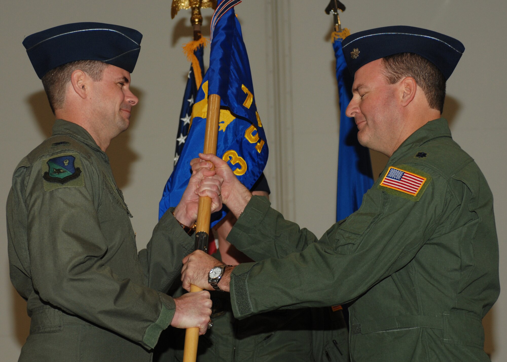CANNON AIR FORCE BASE N.M.-  Col. Michael Plehn (left), 27th Special Operations Group commander, passes the 73rd Special Operations Squadron guidon to Lt. Col. William Wolfe, 73rd SOS commander, signifying the change of command for the squadron during a ceremony Feb.15.  (U.S. Air Force photo by A1C James R. Bell)