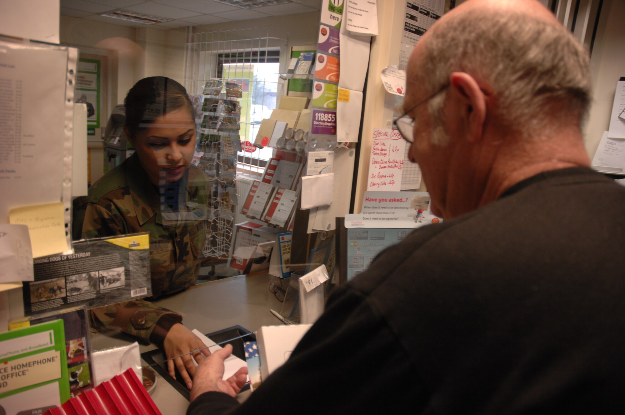 Airman 1st Class Ashley Zamora, 48th Fighter Wing, mails letters at the British Post Office on RAF Lakenheath, Feb 15. Lakenheath members are encouraged to use the variety of services available at the base British Post Office. The services include paying British bills, toping up minutes on mobile phones, internet and phone services and starting Feb 25th, the British Post Office will be able to exchange money between dollars and pounds. (U.S. Air Force photo by Senior Airman Brian J. Ellis)

