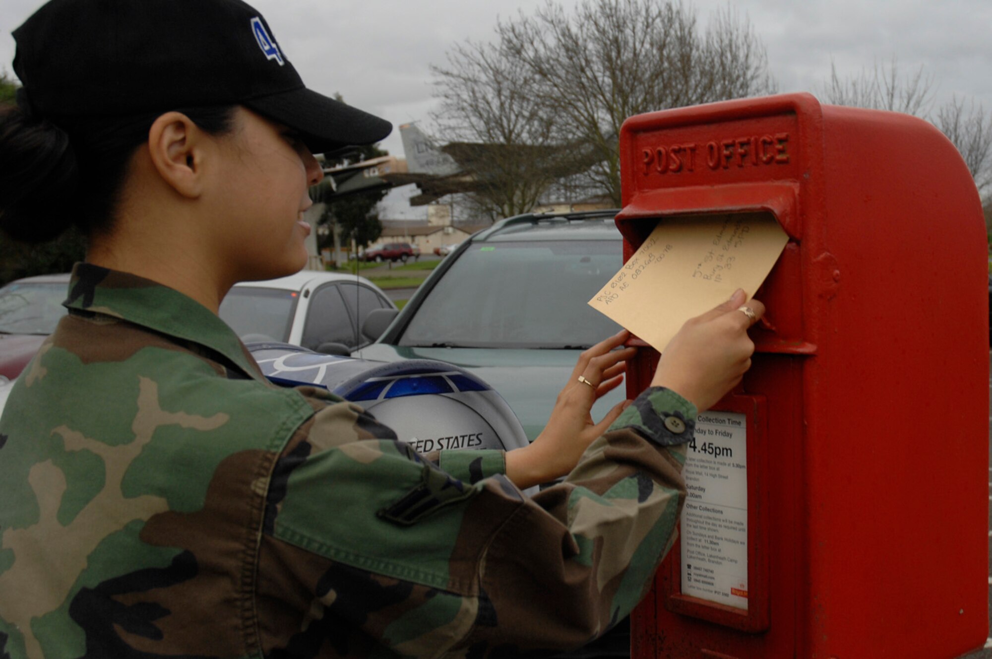 Airman 1st Class Ashley Zamora, 48th Fighter Wing, mails a letter through the British Post, Jan 10 at RAF Lakenheath. Lakenheath members are encouraged to use the variety of services available at the base British Post Office. The services include paying British bills, toping up minutes on mobile phones, internet and phone services and starting Feb 25th, the British Post Office will be able to exchange money between dollars and pounds. (U.S. Air Force photo by Senior Airman Brian J. Ellis)

