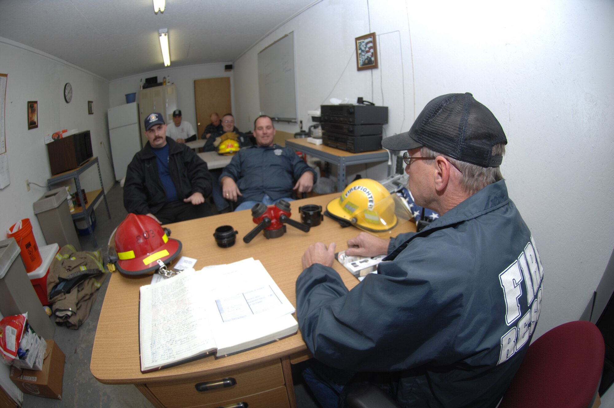 Volunteer firefighters of the Westside Fire and Rescue Department listen to
Tim Brown, fire chief, during their bi-monthly meeting.  The volunteers meet
to maintain their trucks and train firefighting techniques.  (U.S. Air Force
photo by Senior Airman Angelita Lawrence)
