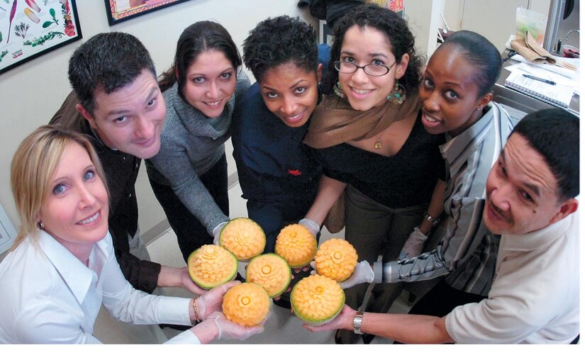 The Executive Airlift Training Center first Advanced Culinary Class students display carved cantalopes along with Navy Culinary Specialist Chief Petty Officer Ernesto Alvarez, far right, during a garnishing class.
(US Air Force/Bobby Jones)