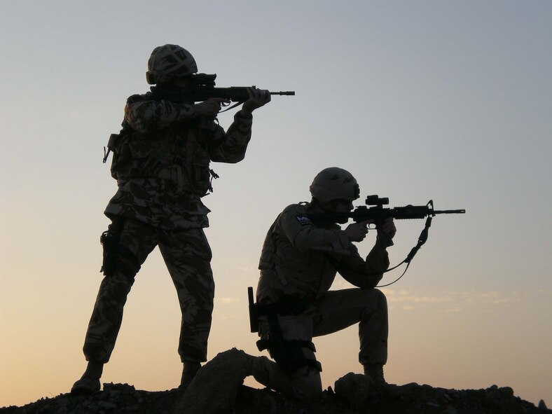 British Sergeant Cass and Staff Sgt. Gregory Haney, NATO Allied Air Component Command Headquarters Ramstein, practice security procedures. (Courtesy Photo)


