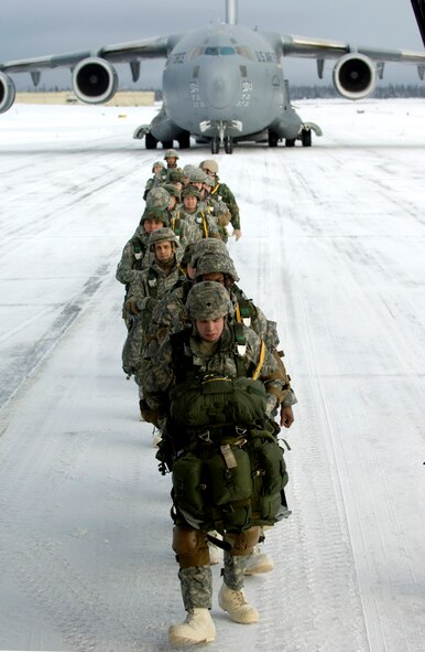 Soldiers from the 4th Quartermasters Detachment at Fort Richardson, Alaska, board a C-17 Globemaster III from the 517th Airlift Squadron at Elmendorf Air Force Base, Alaska, before a training mission. The training mission included parachuting into a drop zone and conducting equipment air drops. (U.S. Air Force photo/Master Sgt. Keith Brown)