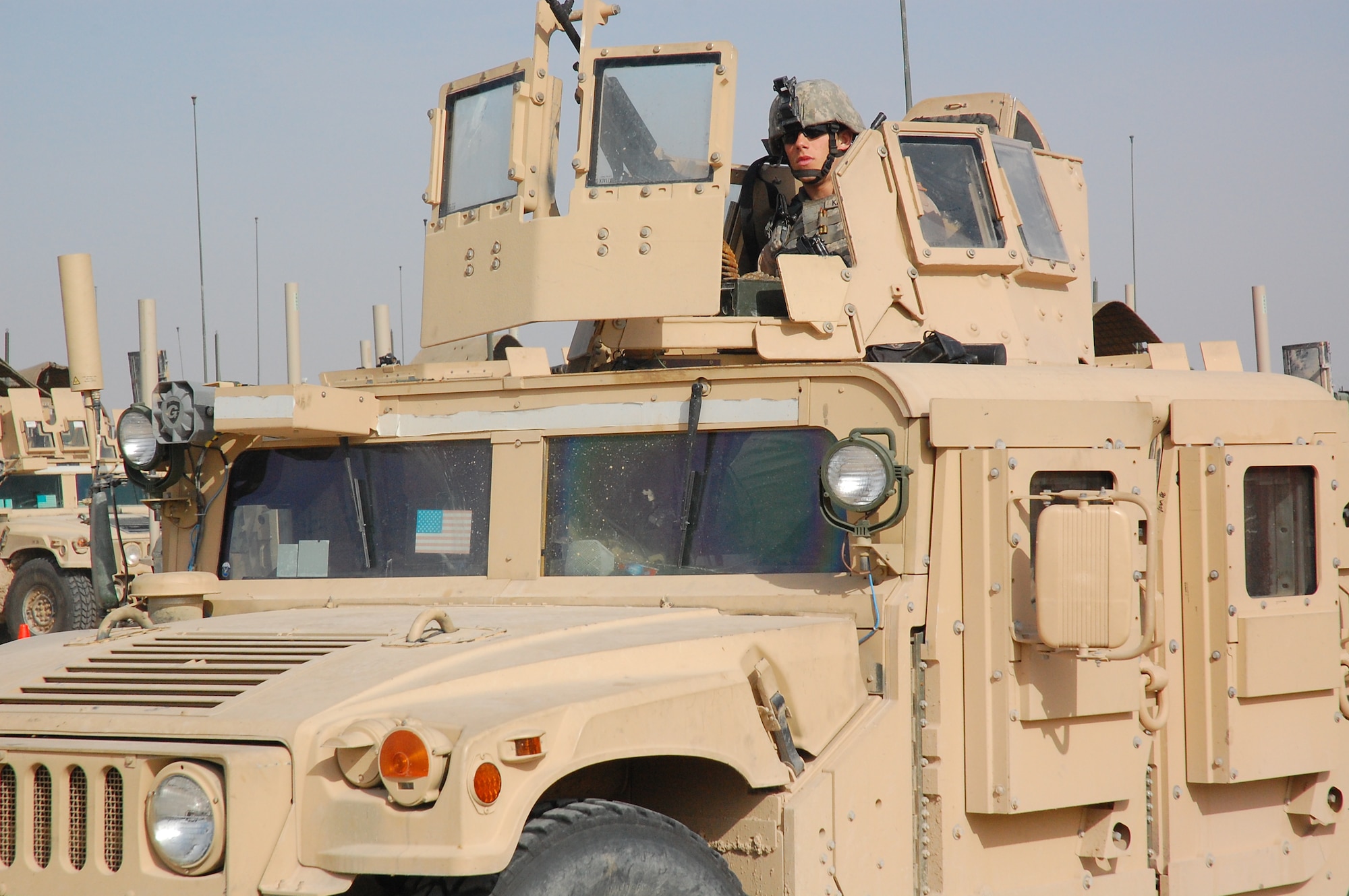 CAMP BUCCA, Iraq -- Airman 1st Class Ryne Kirkland sits in the turret gunner’s position as his truck departs on a mission outside the wire to conduct security operations Feb. 11, 2008. Airman Kirkland is deployed with the 887th Expeditionary Security Forces Squadron, which conducts combat patrols to deter local insurgents from attacking Camp Bucca. The combat patrols include looking for improvised explosive devices and gathering intelligence by directly engaging Iraqis in the local communities.  The squadron is the only U.S. defense force that provides continual patrols outside the wire in southeast Iraq. (U.S. Air Force Photo/Capt. Jason McCree)