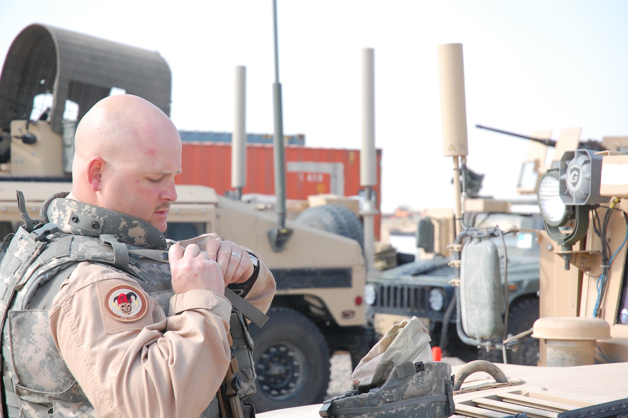 CAMP BUCCA, Iraq -- Tech. Sgt. Tyler Brown readies his gear before going outside the wire to conduct security operations Feb. 11, 2008. Sergeant Brown is deployed with the 887th Expeditionary Security Forces Squadron, which conducts combat patrols to deter local insurgents from attacking Camp Bucca. The combat patrols include looking for improvised explosive devices and gathering intelligence by directly engaging Iraqis in the local communities.  The squadron is the only U.S. defense force that provides continual patrols outside the wire in southeast Iraq. (U.S. Air Force Photo/Capt. Jason McCree)