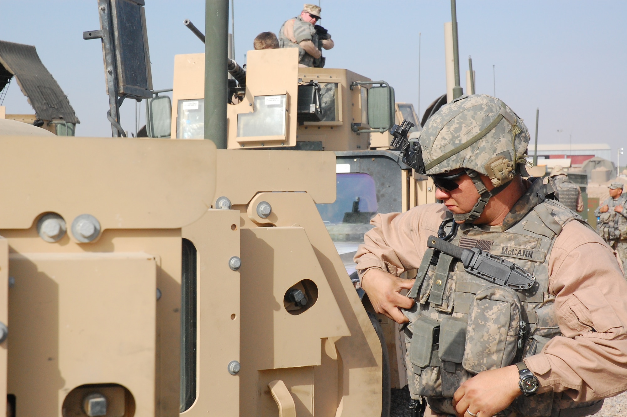 CAMP BUCCA, Iraq -- Airman 1st Class William McCann readies his gear before going outside the wire to conduct security operations Feb. 11, 2008. Airman McCann is deployed with the 887th Expeditionary Security Forces Squadron, which conducts combat patrols to deter local insurgents from attacking Camp Bucca. The combat patrols include looking for improvised explosive devices and gathering intelligence by directly engaging Iraqis in the local communities.  The squadron is the only U.S. defense force that provides continual patrols outside the wire in southeast Iraq. (U.S. Air Force Photo/Capt. Jason McCree)
