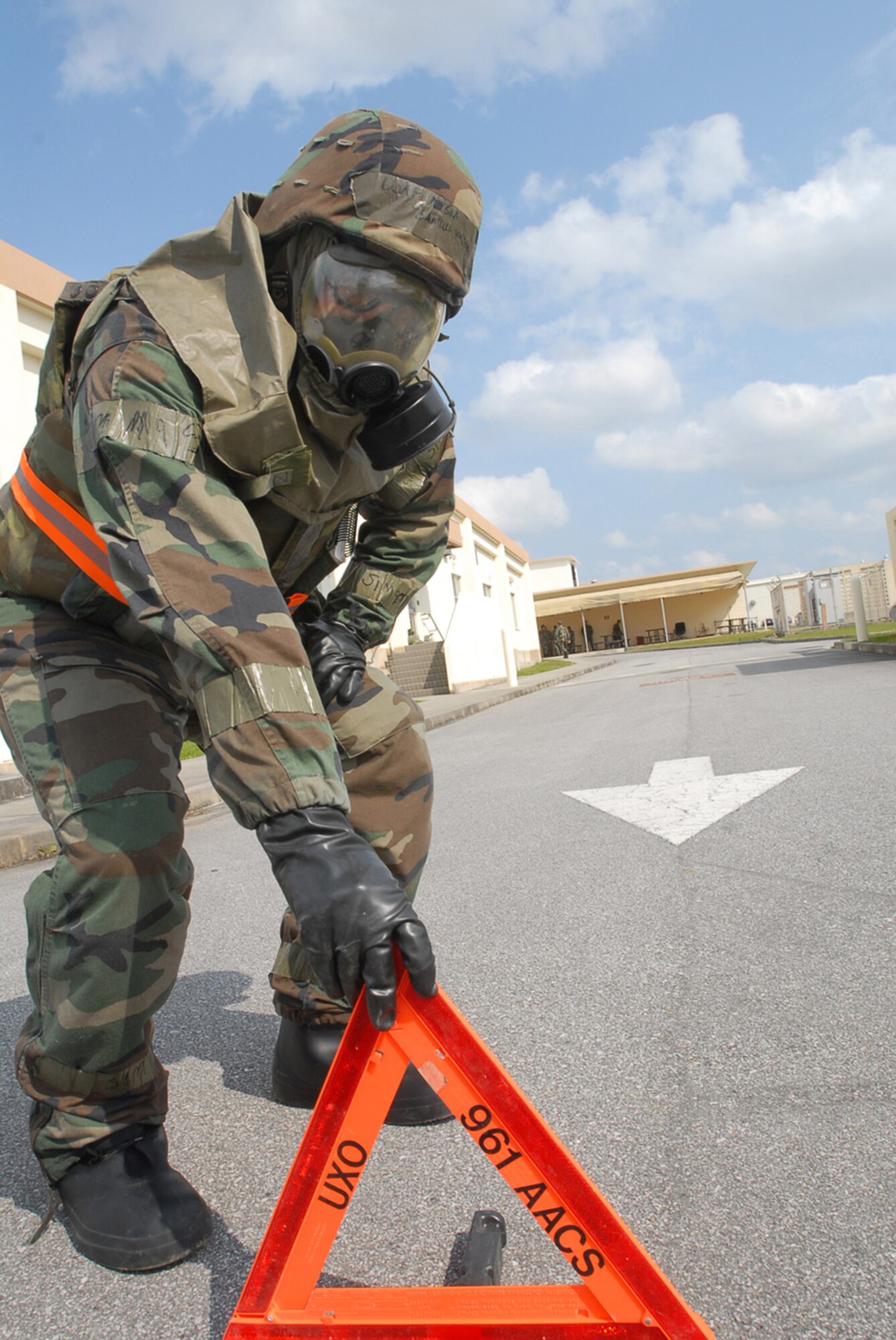 Senior Airman Samuel Wager, 961st Airborne Air Control Squadron, uses an unexploded ordinance sign to mark of the perimeter of a simulated UXO during local operational readiness exercise Beverly High 08-4 at Kadena Air Base, Japan, Feb. 15, 2008. The 18th Wing conducted the exercise from Feb. 10 to 15 to test Airmen's ability to respond in contingency situations. (U.S. Air Force photo/Senior Airman Darnell T. Cannady) 
