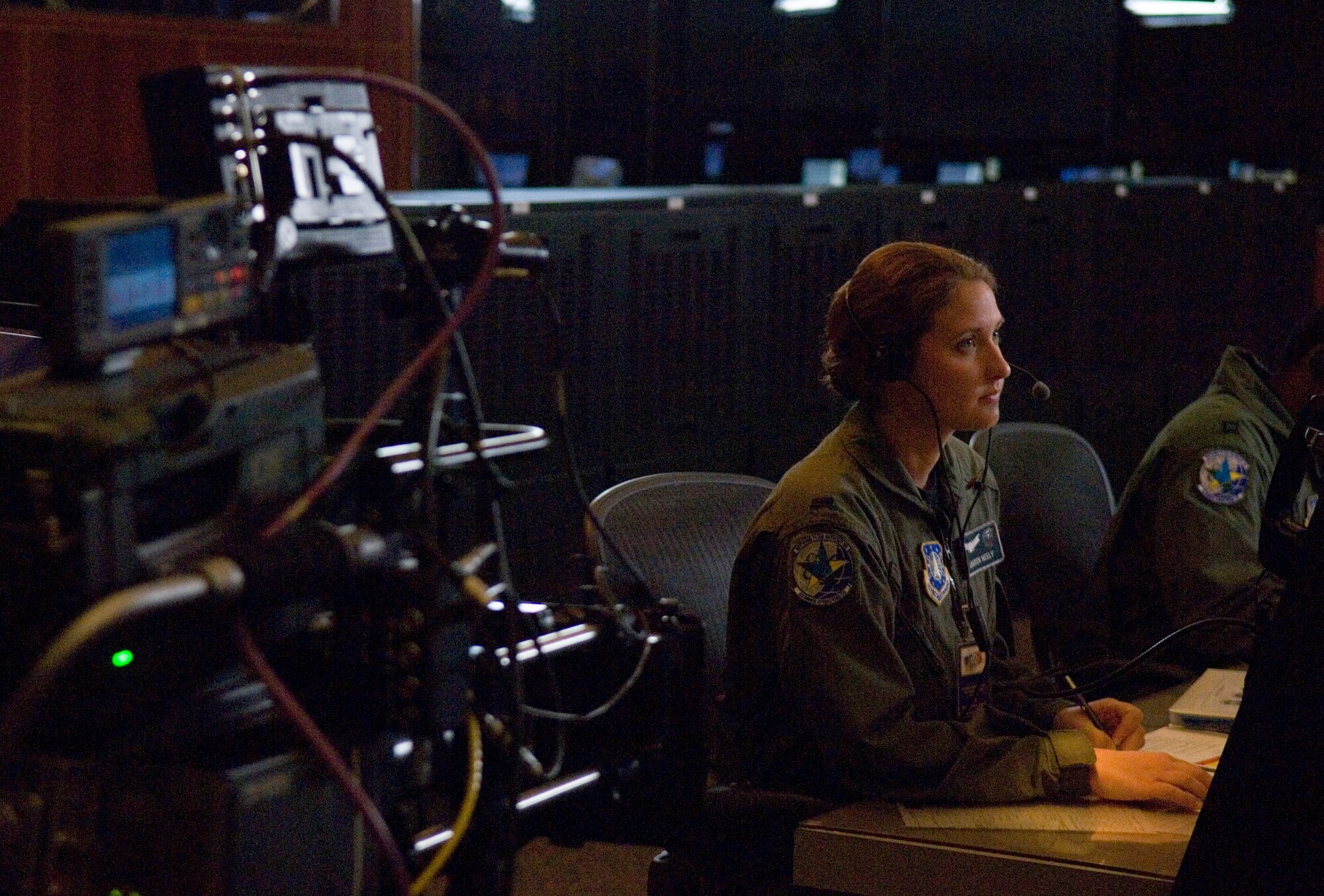 VANDENBERG AIR FORCE BASE, Calif.--First Lieutenant Lauren Neely, a launch control officer with the 2nd Range Operations Squadron, plays the role of herself during the filming of a commercial at the Western Range Operations Control Center here.  The commercial was one of three commercials being produced to both aid in recruiting as well as raise public awareness of three Air Force-unique capabilities.  These capabilities include the missions of Air Force Space Command and Air Force Cyber Command, as well as the Air Force's global reach. (U.S. Air Force photo/Tech. Sgt. Russell McBride)
