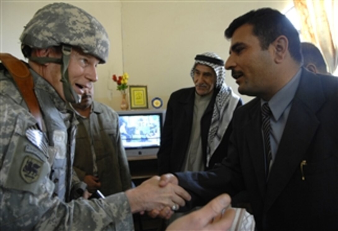 U.S. Army Col. Arthur Wellman, a judge advocate general assigned to the Baghdad Provincial Reconstruction Team, meets with key Iraqi  leaders and councilmen of Tarmiya, Iraq, Feb. 12, 2008.