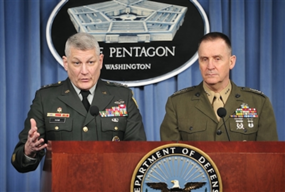Joint Staff Director for Operations Lt. Gen. Carter Ham (left), U.S. Army, and Joint Staff Director for Strategic Plans and Policy Lt. Gen. John Sattler, U.S. Marine Corps, conduct a press briefing in the Pentagon on Feb. 15, 2008.  Ham and Sattler gave the reporters an operational update and fielded questions.  