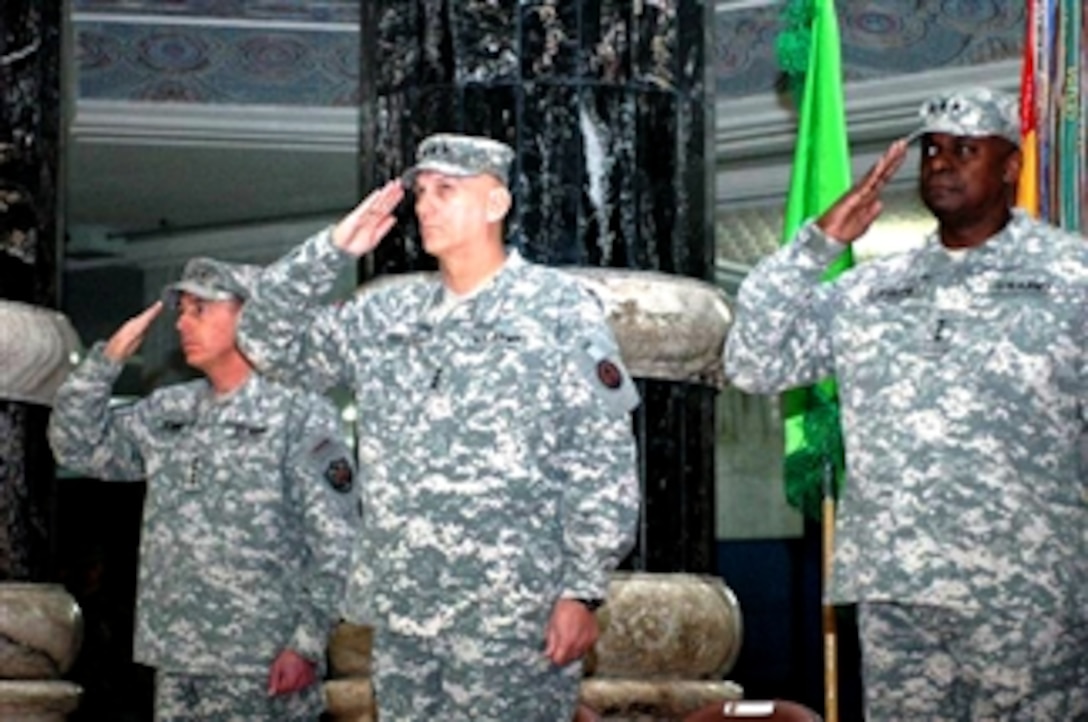 Army Gen. David Petraeus, left, Multi-National Force-Iraq commanding general, Army Lt. Gen.
Ray Odierno, center, III Corps commander, and Army Lt. Gen. Lloyd J. Austin III, Multi-National
Corps-Iraq commander, salute the colors during a change of command ceremony at Al Faw
Palace on Feb. 14. Austin assumed command of Multinational Corps Iraq from Odierno, who is scheduled to become the U.S. Army’s next vice chief of staff.
