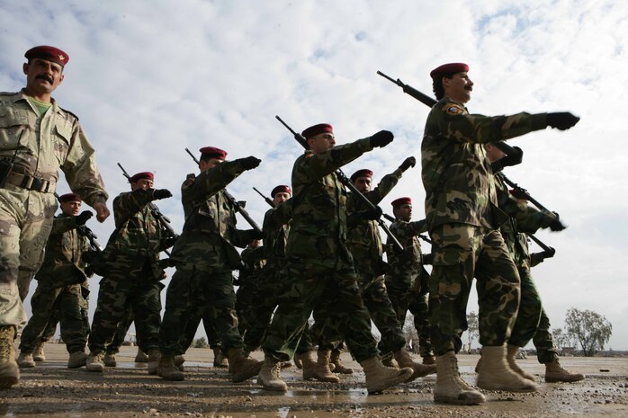 Iraqi soldiers with 2nd Regiment, 2nd Brigade, 1st Division, practice marching for their graduation ceremony aboard the Iraqi Training Center in Al Anbar province, Iraq, Feb. 15, 2008. The Iraqis are trained by U.S. Marine Military Transition Team, 2nd Battalion, Regimental Combat Team 1, to operate in the Northern part of Iraq. RCT-1 is deployed with Multi National Force-West in support of Operation Iraqi Freedom in the Al Anbar province of Iraq to develop Iraqi Security Forces, facilitate the development of official rule of law through democratic reforms, and continue the development of a market-based economy centered on Iraqi reconstruction.