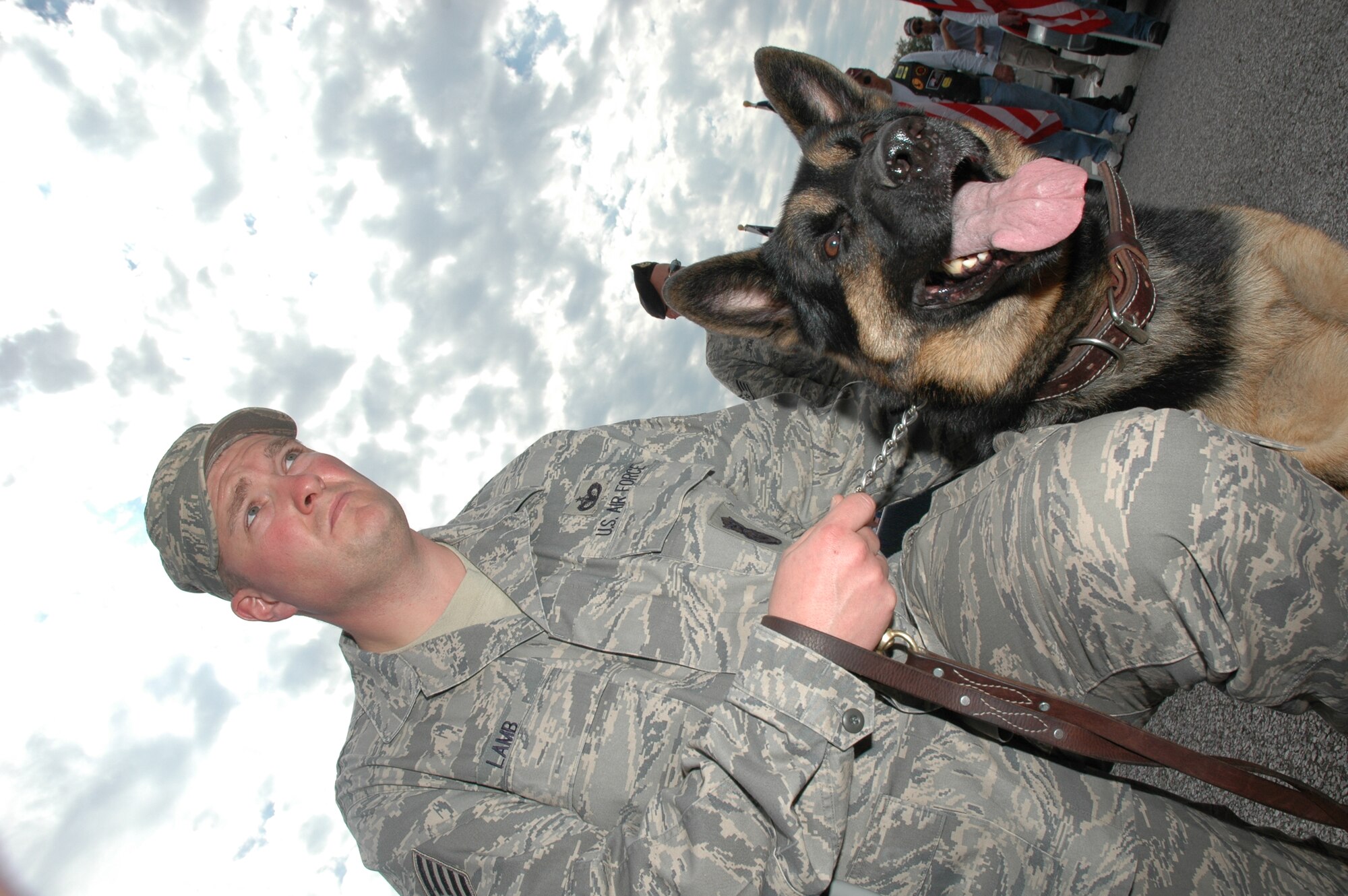 Tech. Sgt. Michael Lamb, Elmendorf Air Force Base, Alaska, and Jack, age 6, helped pay respect to all working dogs during the ceremony at the Air Armament Museum today.The team are at Eglin Air Force Base, Fla., for training before heading off on their assignment overseas.  (USAF phot/Staff Sgt. Stacia Zachary)
