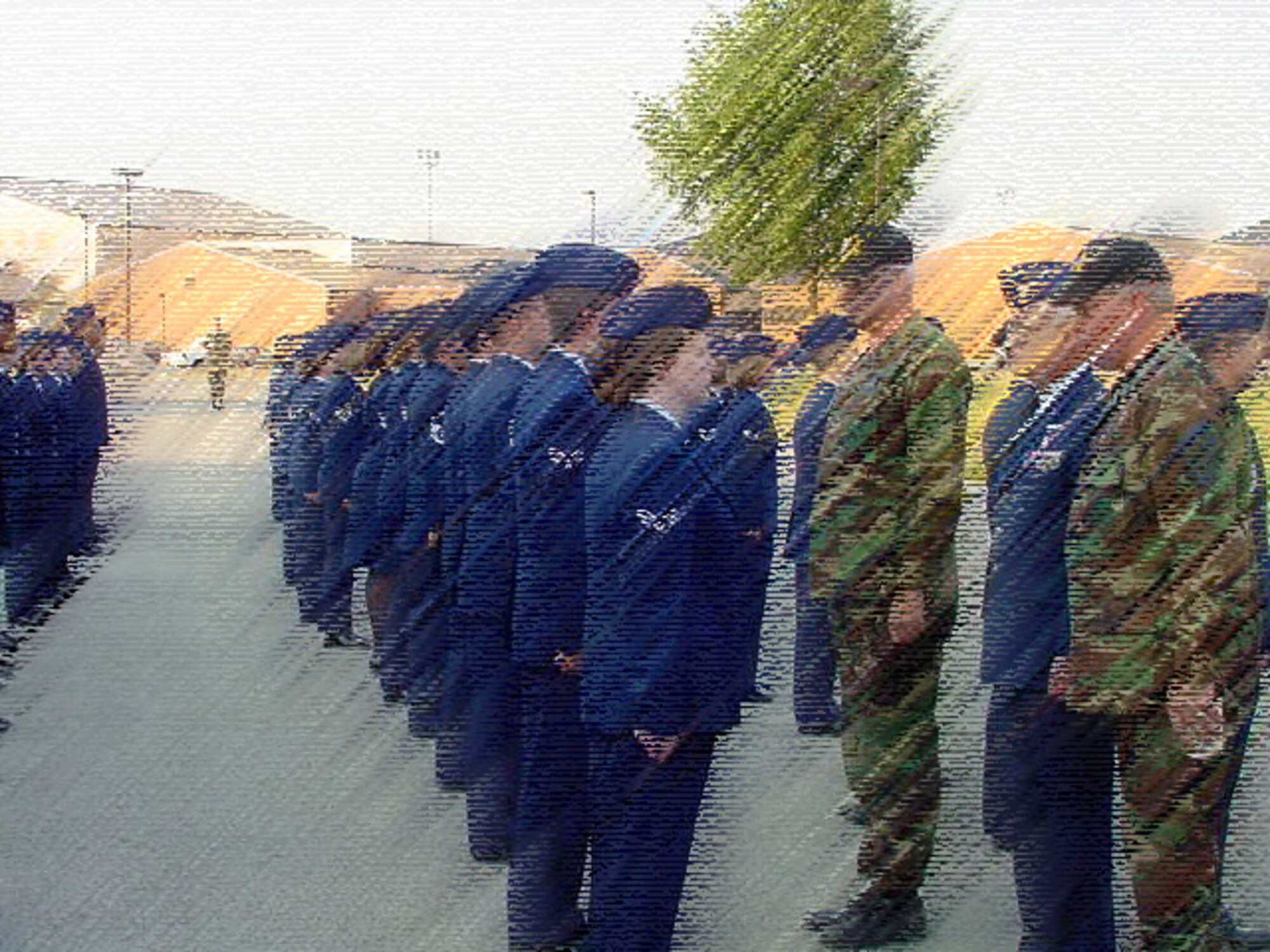 An open ranks inspection was done on a summer day in 2002 by the commander of the 932nd Airlift Wing back then, Col. Oral Carper.  Assisting were the commander of the Medical Group, Col. Roger Wujek, and the 932nd Airlift Wing Command Chief Master Sgt. Merle Lyman.  Artwork rendering from 932 AW/PA.