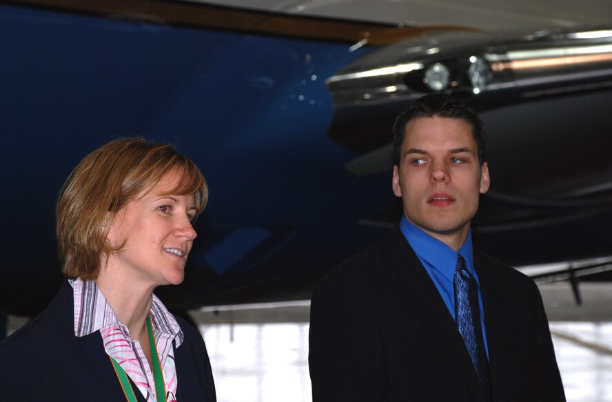 Tech. Sgt. April Tarbill and Senior Airman Bob Fourman, both flight attendants with the 73rd Airlift Squadron, 932nd Airlift Wing, speak to other Air Force Airmen about opportunities in the Air Force Reserve Command flight attendant program.