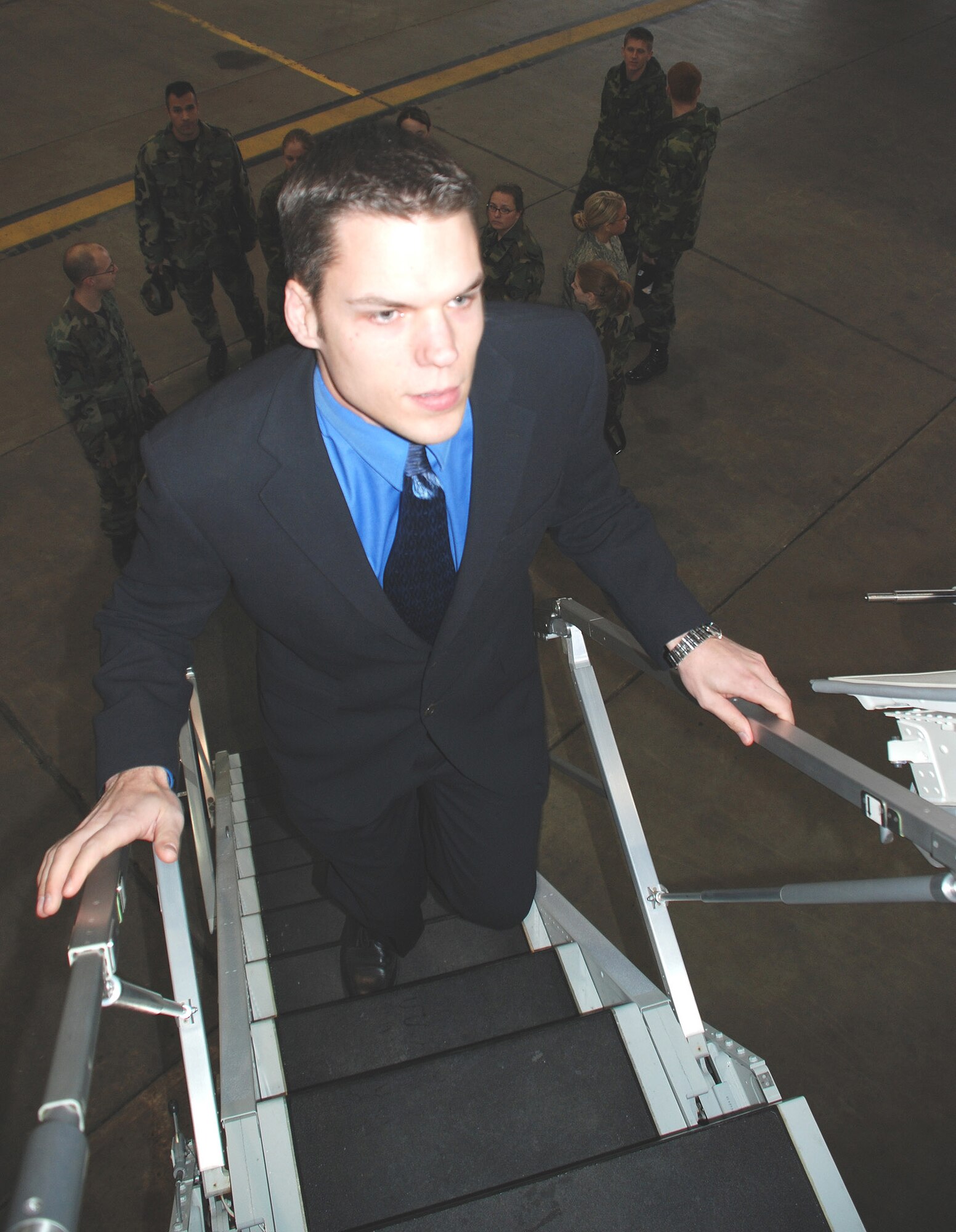 Senior Airman Bob Fourman, a flight attendant with the 73rd Airlift Squadron, 932nd Airlift Wing, walks the steps of a C-40C plane belonging to the Illinois Air Force Reserve Wing.  He recently gave other enlisted Airmen a chance to see the plane and learn about the distinguished visitor mission and the work involved in being a flight attendant.  Those interested in cross training must have a five level in their current position.  Photo/Capt. Stan Paregien