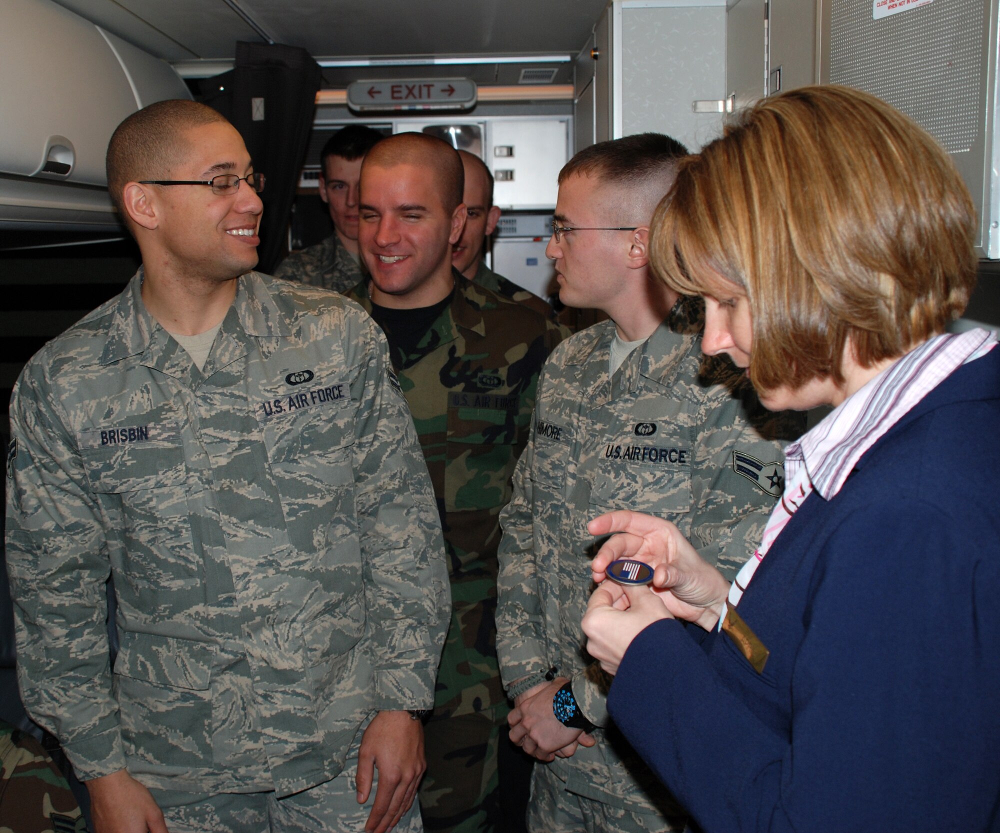 Tech. Sgt. April Tarbill, a flight attendant with the 73rd Airlift Squadron, 932nd Airlift Wing, speaks to other Air Force Airmen about opportunities in the Air Force Reserve Command flight attendant program.  Here she looks at a coin that was given to her by a distinguished visitor.  The flight attendants meet a wide variety of people.

"They love this job and work hard, but enjoy worldwide travel, and we are now requested by name by higher level Department of Defense leaders," said Col. Tom 
Kirkendall, the 932nd Operations Group commander. 

It takes a special person to make service for high-level passengers -- to include 
the chairman of the Joint Chiefs of Staff, the First Lady of the United 
States, the secretary of State, secretary of the Interior, the CIA director and the 
speaker of the House, just to name a few.


Tech. Sgt. Elizabeth Wszalek just celebrated her one year anniversary as a 
932nd AW flight attendant. She didn't always have food preparation skills. 

"I used to do the bare minimum cooking at home and was an experimental 
salad girl in high school. I then transferred from the Mission Support Flight 
and went to flight attendant training, and now I cook all the time. 

"The biggest challenge for me is making contact with the head of the VIP 
party we are dealing with to make sure they select the menu items in a timely 
manner so we (flight attendants) can grocery shop for the mission. 

This involves mission prep, checking ice requirements 
at each stop, getting enough pillows and blankets, and checking air 
stairs availability. We do a lot more than basic airline attendants. We even load 
luggage, cook full meals and are responsible for emergency procedures," she 
said. 