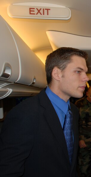 Senior Airman Bob Fourman, a flight attendant with the 73rd Airlift Squadron, 932nd Airlift Wing, checks the interior and exit rows of a C-40C plane belonging to the 932nd Airlift Wing. 

He recently gave other enlisted Airmen a chance to see the plane and learn about the distinguished visitor mission and the work involved in being a flight attendant. Those interested in cross training must have a five level in their current position. Photo/Capt. Stan Paregien