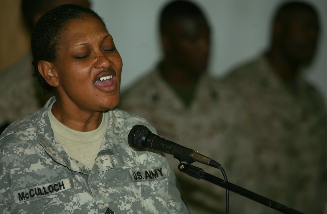 Army Staff Sgt. Cassandra McCulloch, 38, from Clarksville, Texas, leads a gospel choir in praise at Camp Taqaddum's Mainside Chapel Feb. 17. The chapel also hosts worship services for Mormons, Catholics and Protestants every Sunday, as well as Bible study groups and self-improvement courses throughout the week. The Chaplain Corps organizes the services and ensures that all service members and DOD civilians have what they need to exercise their religious rights. McCulloch is deployed to Al Anbar Province as a disbursing specialist and noncommissioned officer in charge of a female search team.
