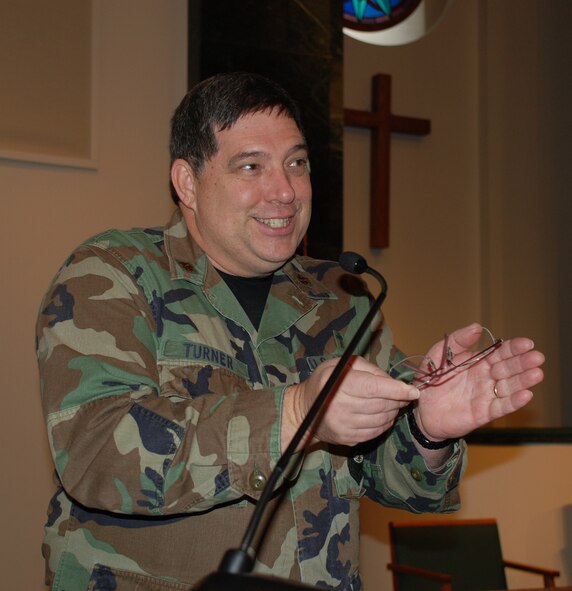 Chapel staff, Chaplain Major Keith Turner, gestures with enthusiasm from the pulpit. The chapel staff is located at Chapel One, room 122 during UTA Hours.