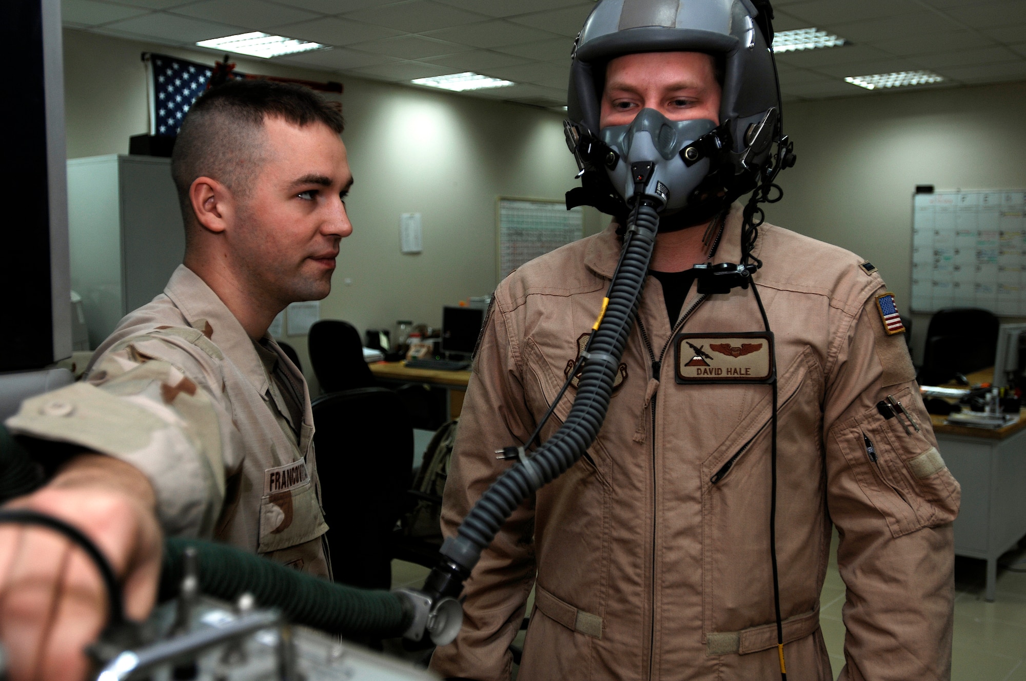 SOUTHWEST ASIA -- Senior Airman Joshua Francovitch, an aircrew flight equipment technician from the 386th Expeditionary Operations Support Squadron, assists 1st Lt. David Hale, a C-130 Hercules navigator from the 737th Expeditionary Airlift Squadron, with a fit-check of his oxygen mask at a Southwest Asia air base Feb. 9, 2008. The fit-check ensures the mask holds a seal and is fit to the person’s face.  Both Airman Francovitch and Lieutenant Hale are deployed from Yokota Air Base, Japan, in support of Operations Enduring and Iraqi Freedom. (U.S. Air Force photo/ Staff Sgt. Patrick Dixon)