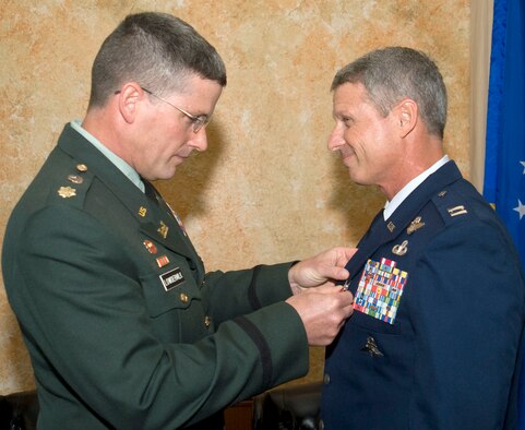 Capt. Greg Lowdermilk, a 920th Rescue Wing Combat Rescue Officer, spent his 27-year Air Force career in the elite pararescue field saving lives and breaking new ground.  He retired Feb. 15 from a legendary career as a pararescueman and combat rescue officer.  His brother, Maj. Eldon Scott Lowdermilk, U.S. Army Corps of Engineers, Tikrit, Iraq, was the presiding officer who presented him with the Meritorious Service Medal.  Although retired, Captain Lowdermilk will begin a new adventure in New York City as a project manager for a New York City company. (U.S. Air Force Photo/Mr. James Laviska)