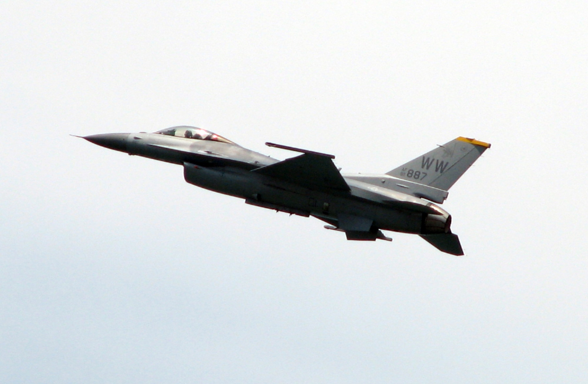 Maj. Jon Plasterer, a Pacific Air Forces F-16 Demonstration Team pilot from Misawa Air Base, Japan, performs during the opening day of the Singapore Air Show Feb. 19.  The United States military is participating in the event Feb. 19-24.  A cross-section of aircraft and equipment are on static display to include F-15C, F-16CJ and F/A-18C multi-role fighters, a WC-130J weather reconnaissance aircraft, KC-135 tanker and B-1B bomber.  The Pacific Air Force?s F-16 demonstration team and Pacific Fleet?s F/A-18 demonstration team are performing daily. (U.S. Air Force Photo by Senior Master Sgt. Charles Ramey) 
