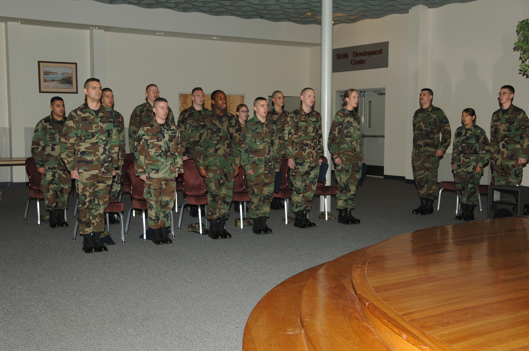 FAIRCHILD AIR FORCE BASE, Wash. -- Airmen, non-commissioned officers and officers recite the Honor Guard Creed during an honor guard graduation ceremony at the Deel Community Center here Feb. 15. The graduates completed five days of training consisting of all ceremonial aspects of the honor guard. (U.S. Air Force photo / Senior Airman Jocelyn Ford)