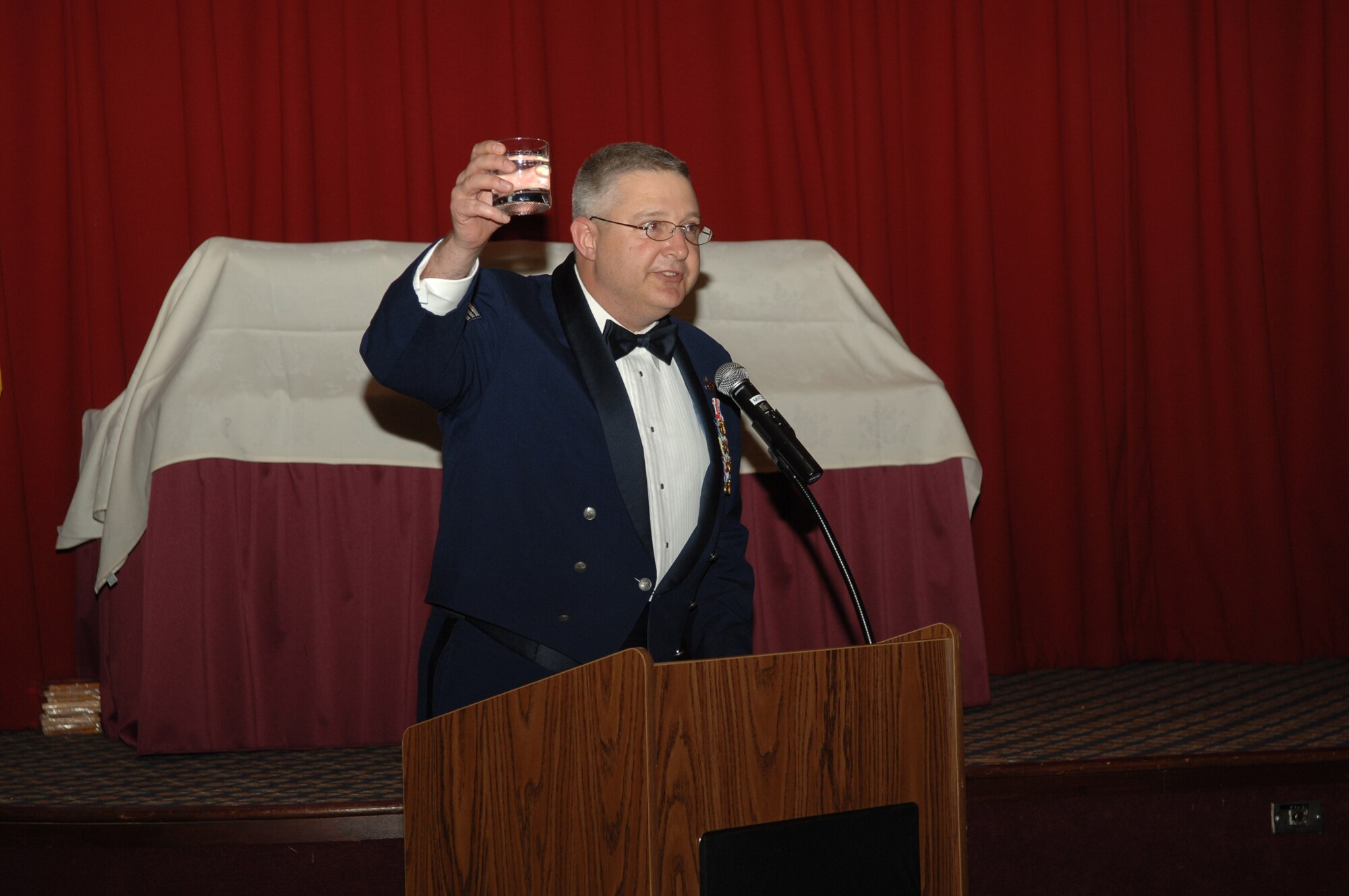 FAIRCHILD AIR FORCE BASE, Wash. -- Chief Master Sgt. Paul Sikora, 92nd Air Refueling Wing command chief, presents a toast to all the 2007 Annual Awards nominees at Club Fairchild Feb. 15. Chief Master Sgt. Robert Gaylor (ret.), fifth Chief Master Sgt. of the Air Force, and his wife were two of the honored guests at the event. (U.S. Air Force photo / Senior Airman Jocelyn Ford)