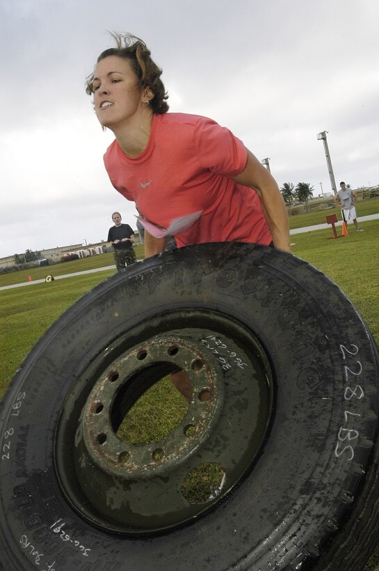 Karrie Irvin was one of two women to compete in the Strongman Challenge. She muscled her way through all of the obstacles and won 1st place in the competition. (U.S. Air Force photo by Master Sgt. Lisa M. Zunzanyika)      