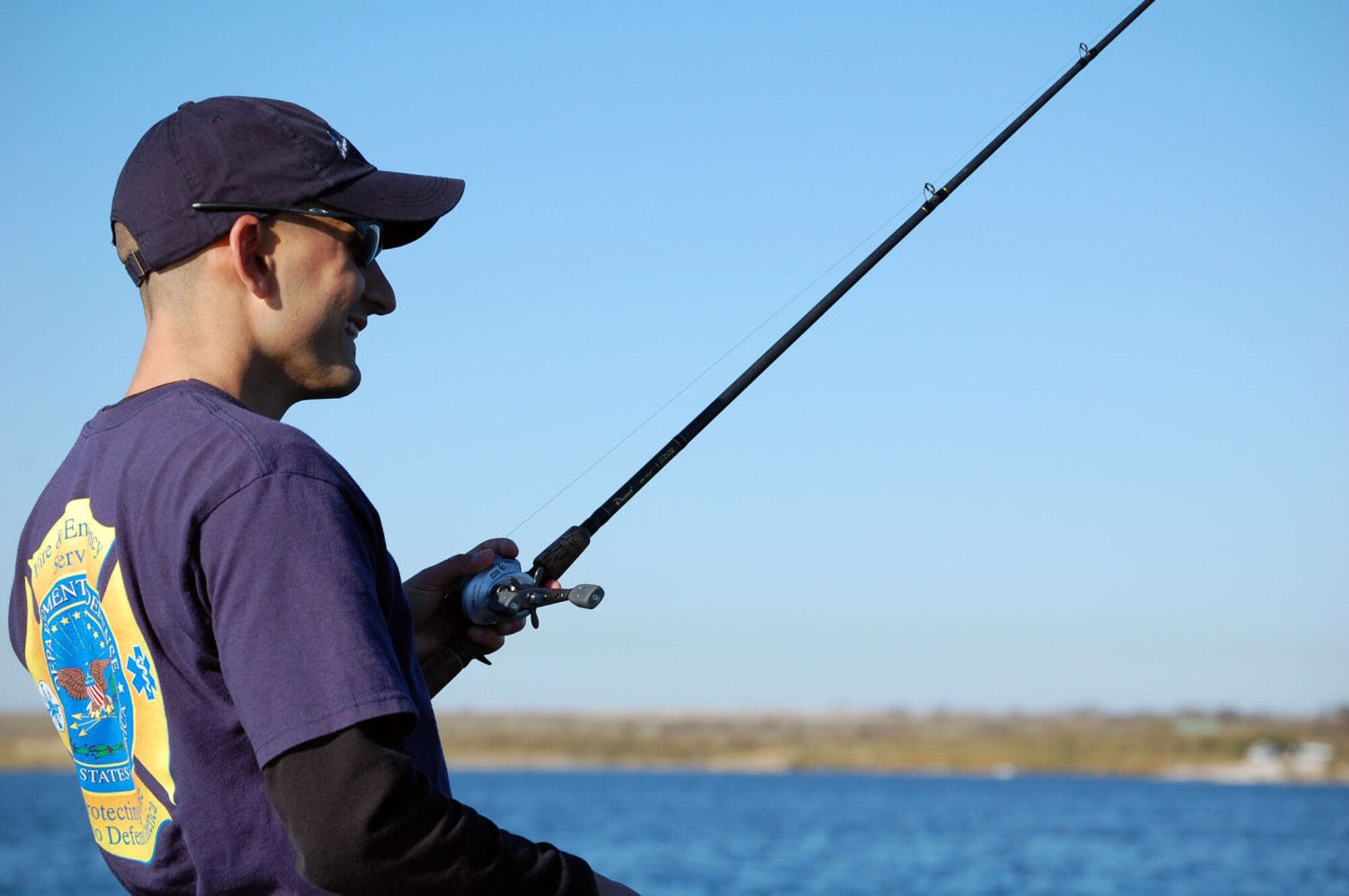 LAUGHLIN AIR FORCE BASE, Texas – Senior Airman James Croswell, 47th Civil Engineer Squadron, starts his fishing trip with Bass Angler Sports Society’s Professional Byron Velvick at Lake Amistad Feb. 13. Velvick surprised Airman Croswell during the morning shift change at the Fire Department so he could take him fishing on ESPN’s reality show, “Wanna Go Fishing.”(U.S. Air Force photo by Airman Sara Csurilla)

