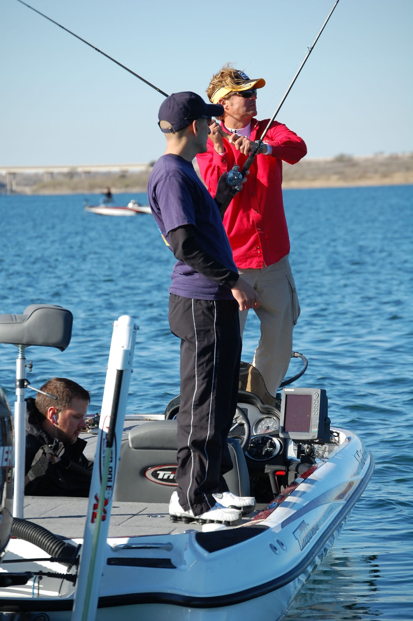 LAUGHLIN AIR FORCE BASE, Texas – Senior Airman James Croswell, 47th Civil Engineer Squadron, starts his fishing trip with Bass Angler Sports Society’s Professional Byron Velvick at Lake Amistad Feb. 13. Velvick surprised Airman Croswell during the morning shift change at the Fire Department so he could take him fishing on ESPN’s reality show, “Wanna Go Fishing.”(U.S. Air Force photo by Airman Sara Csurilla)