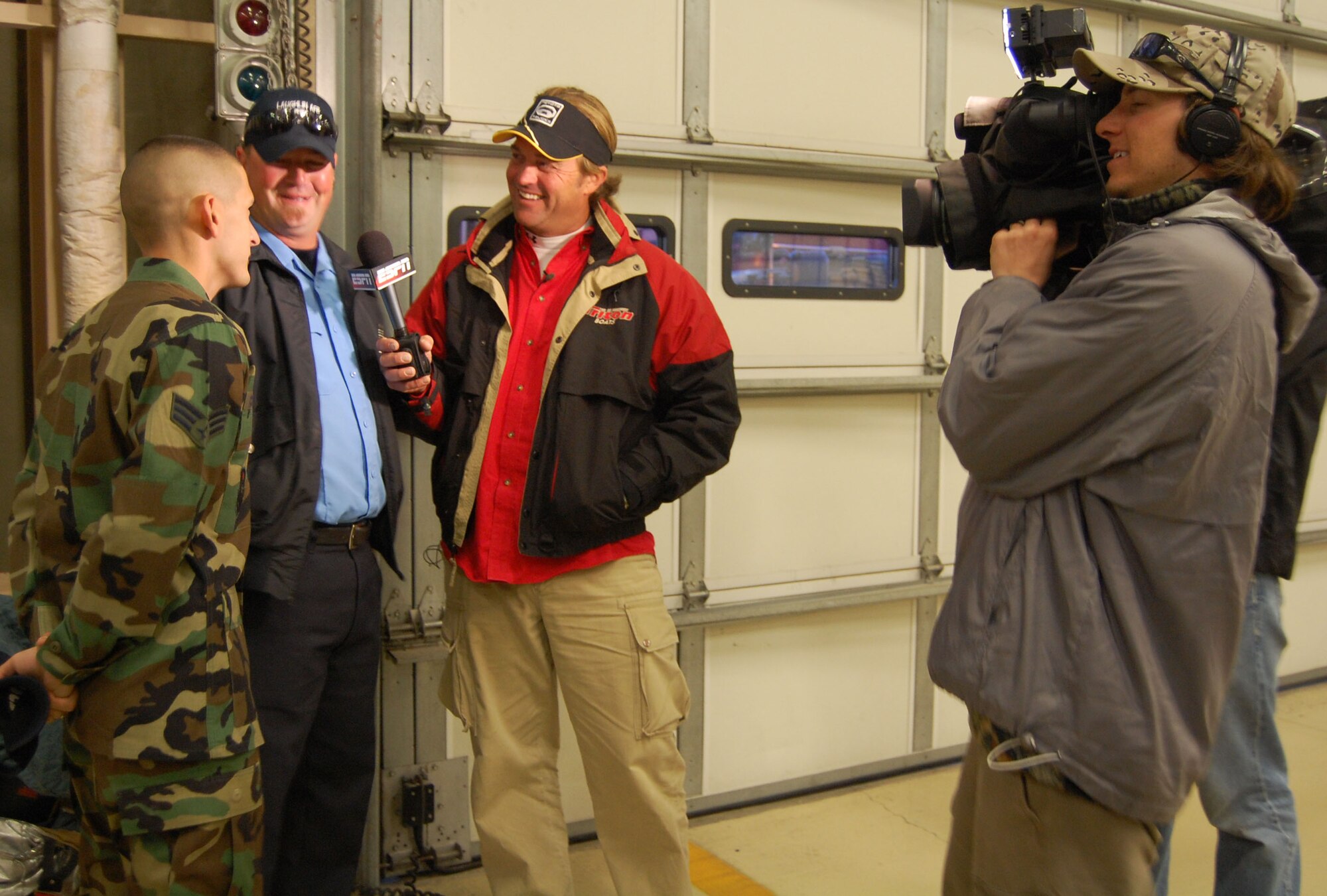 LAUGHLIN AIR FORCE BASE, Texas – Senior Airman James Croswell, 47th Civil Engineer Squadron, talks to Byron Velvick, Bass Angler Sports Society’s Professional Byron Velvick on camera before they head out to Lake Amistad to start their fishing trip Feb. 13. Velvick surprised Airman Croswell during the morning shift change at the Fire Department so he could take him fishing on ESPN’s reality show, “Wanna Go Fishing. ”(U.S. Air Force photo by Airman Sara Csurilla)