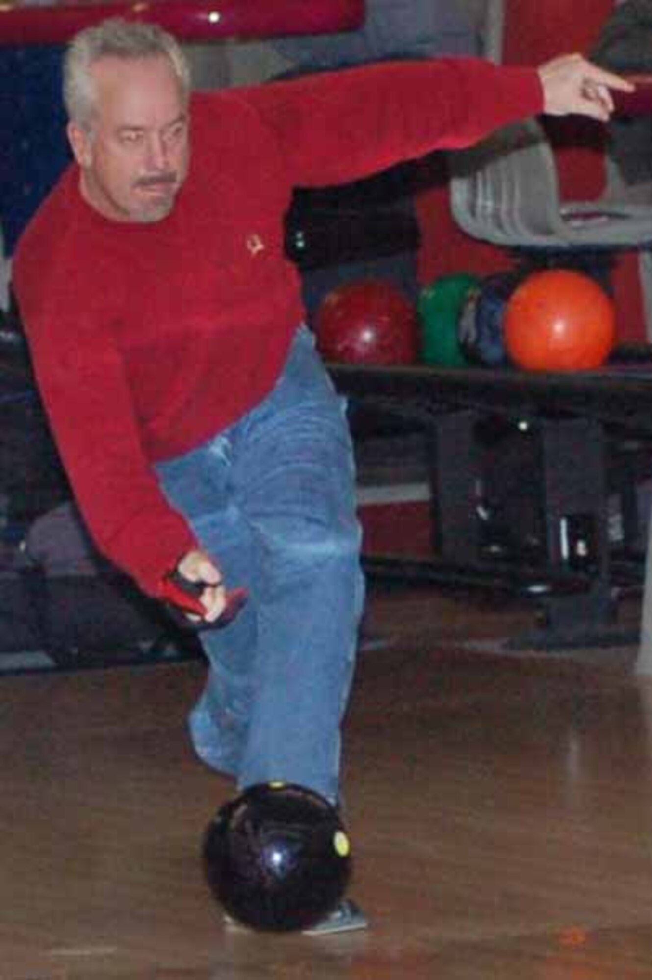 DISA bowler Mike Wang throws a  strike in a match against Hellfino at the Tinker Bowling Center on Feb 6. THe match between the two top teams in the league resulted in a draw.