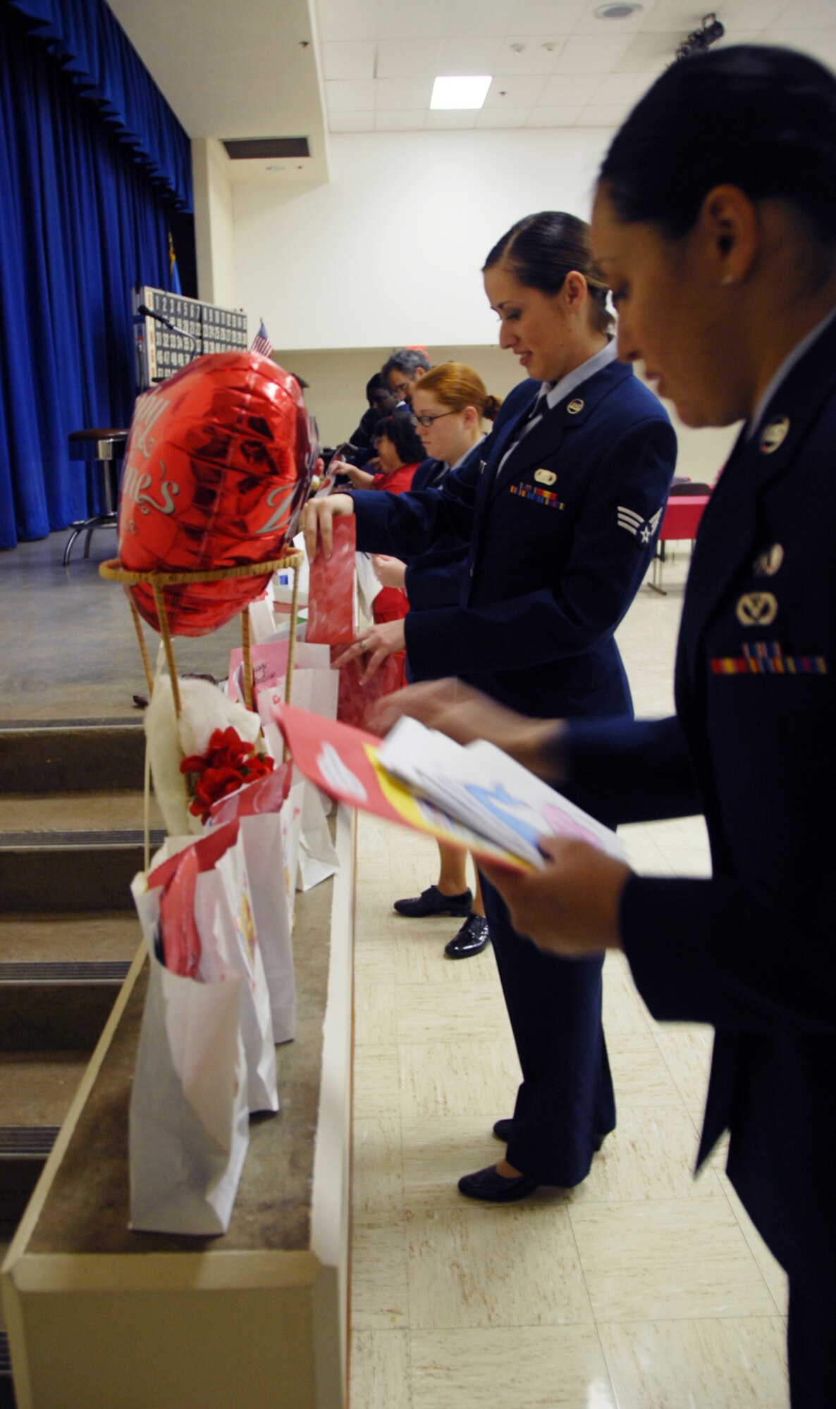 ALTUS AIR FORCE BASE, Okla. -- Altus AFB Airmen prepare valentines for veterans during the annual Valentine's for Vets visit to the Oklahoma Veterans Center in Clinton, Okla. The valentines were made by children from Rivers Elementary School, Child Development Center and Wilson Head Start Program. (U.S. photo/Airman 1st Class Jennifer Flores)