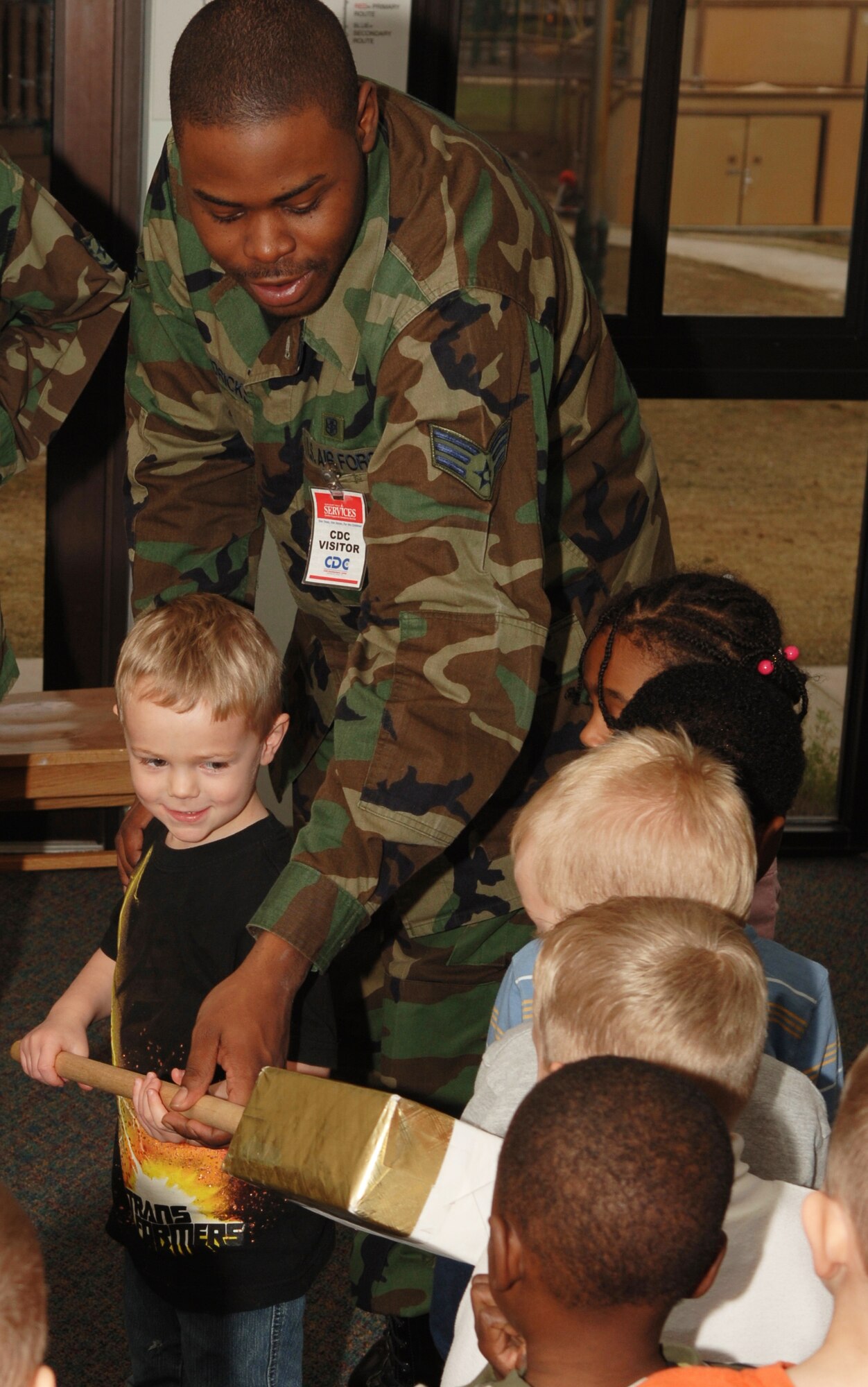 Senior Airman Christopher Hendricks, 1st Special Operations Dental Squadron, helps his "dental assistant" out during a toothbrushing exercise Feb. 14 at the Child Development Center. Several Airmen from the 1st SODS visited the CDC on Valentine's Day to educate the children about proper dental hygiene as part of National Children's Dental Health Month. (U.S. Air Force photo/Airman 1st Class Matthew Loken)