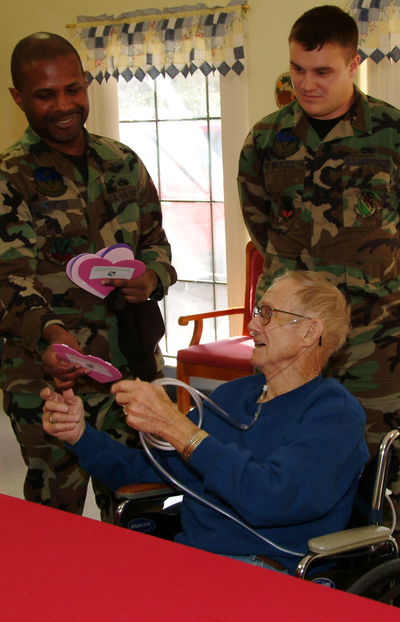 Master Sgt. Meoyski Porter, 53d Electronic Warfare Group, presents a Valentine to Homer Guernsey Feb. 14 at the Silvercrest Rehabilitation Center in Crestview Fla.  More than 50 active duty 53d Wing members presented vets in nursing homes around the local area with cards and candy on Valentine's Day.  U.S. Air Force photo by Master Sgt. Andrew Leonhard.  