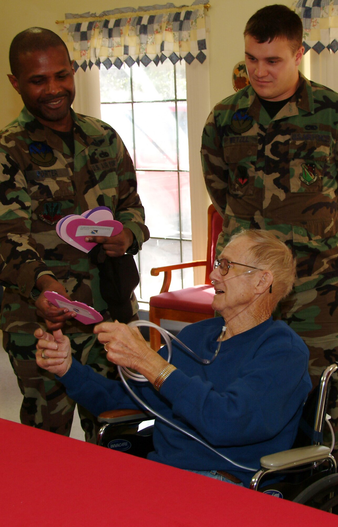 Master Sgt. Meoyski Porter, 53d Electronic Warfare Group, presents a Valentine to Homer Guernsey Feb. 14 at the Silvercrest Rehabilitation Center in Crestview Fla.  More than 50 active duty 53d Wing members presented vets in nursing homes around the local area with cards and candy on Valentine's Day.  U.S. Air Force photo by Master Sgt. Andrew Leonhard.  