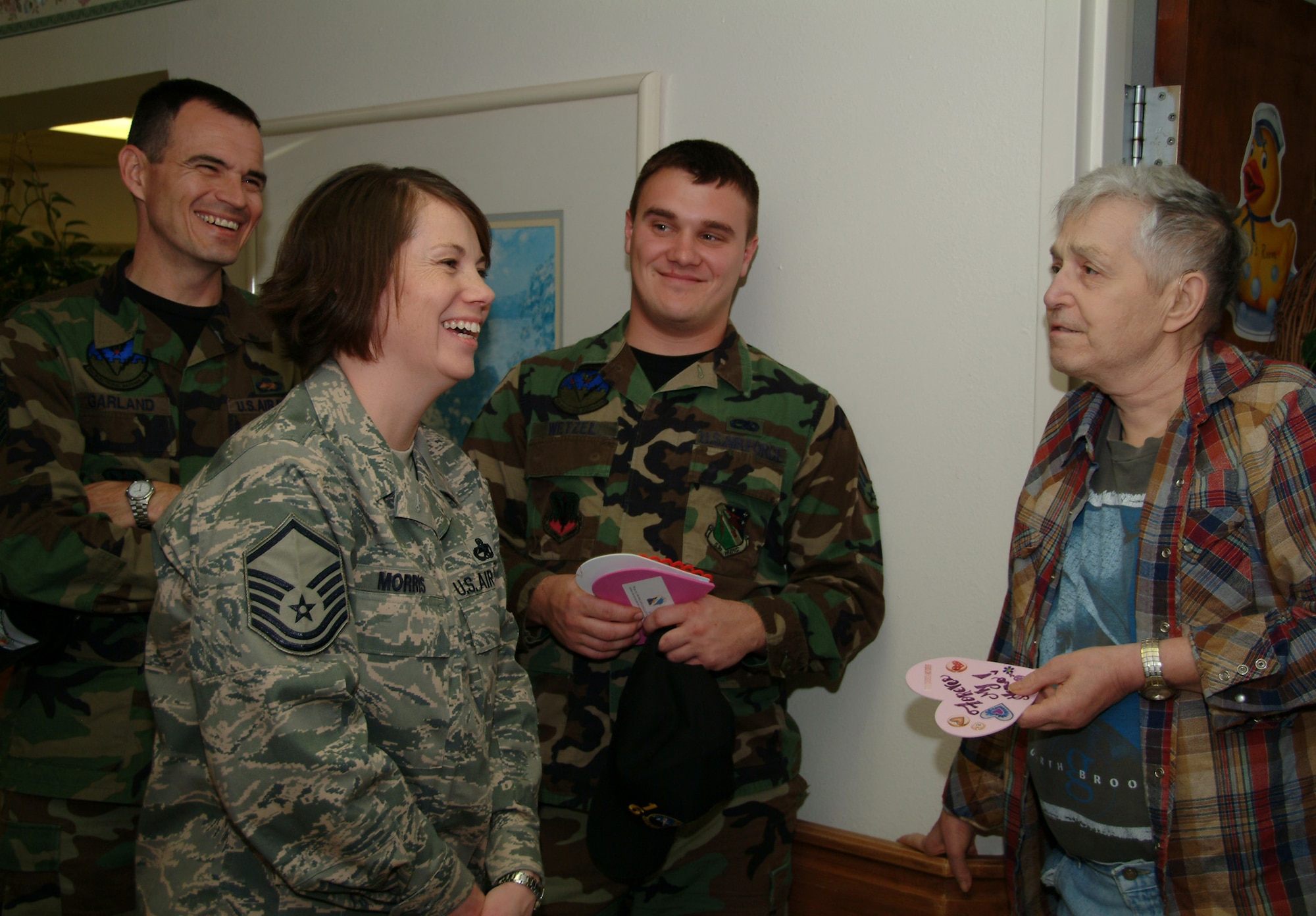 Master Sgt. Julie Morris, 16th Electronic Warfare Squadron, along with Senior Master Sgt. Michael Garland, 16th EWS, and Senior Airman Jon Wetzel, 16th EWS, visit with Wayne Parks Feb. 14 at the Silvercrest Rehabilitation Center in Crestview Fla.  More than 50 active duty 53d Wing members presented vets in nursing homes around the local area with cards and candy on Valentine's Day.  U.S. Air Force photo by Master Sgt. Andrew Leonhard.  