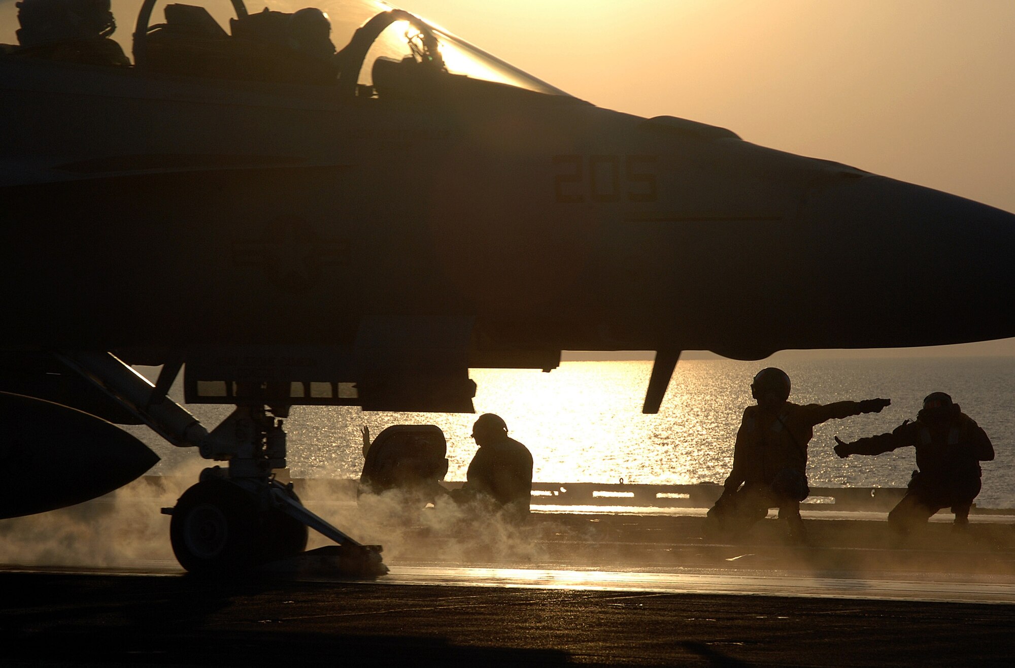 PERSIAN GULF -- A U.S. Navy shooter gives the signal for an F/A-18F Super Hornet aircraft attached to Strike Fighter Squadron Three Two to launch from the flight deck of Nimitz-class aircraft carrier USS Harry S. Truman (CVN 75) while under way in the Persian Gulf. (U.S. Navy photo by Seaman Kevin T. Murray, Jr.)