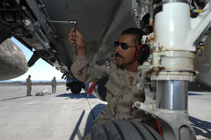 NELLIS AIR FORCE BASE, Nev.—Royal Saudi air force Sgt. Abdulrahman Al-Shhrani, a crew chief assigned to the 6th Squadron, conducts routine maintenance on a F-15S after a Red Flag mission here Feb. 12. Red Flag is a multi-national exercise providing pilots with a realistic environment to practice combat scenarios. The experience gained during the exercise is vital to the survival of pilots in combat. (U.S. Air Force photo by Senior Airman Larry E. Reid Jr.)